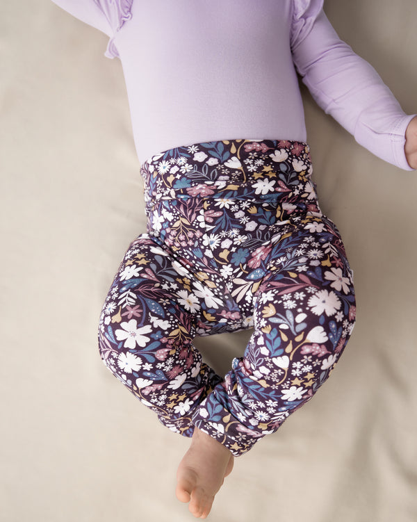 Close up of newborn wearing the Midnight Petals Fold Over Legging 
