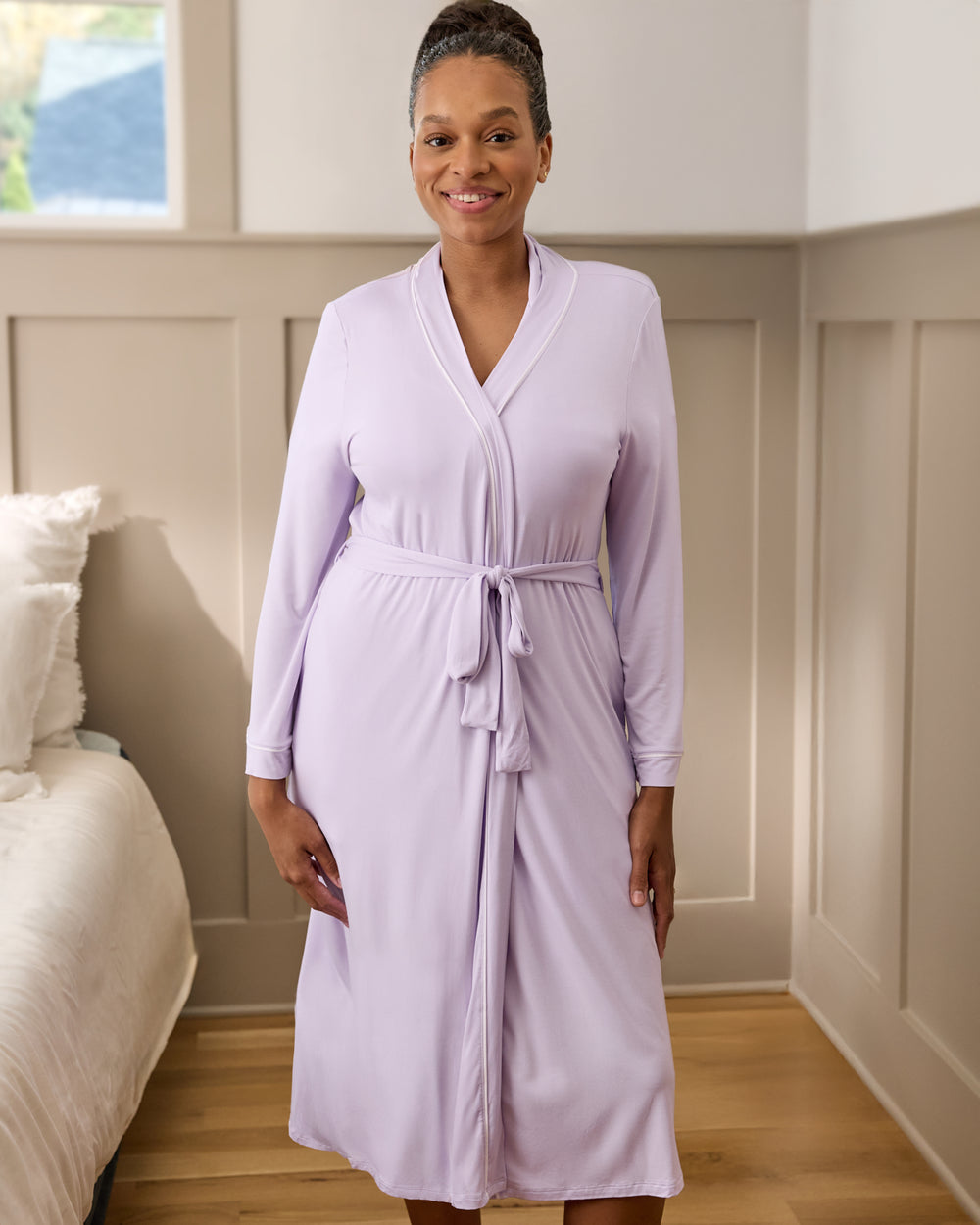 Woman wearing the Misty Lavender Women's Robe in a bedroom