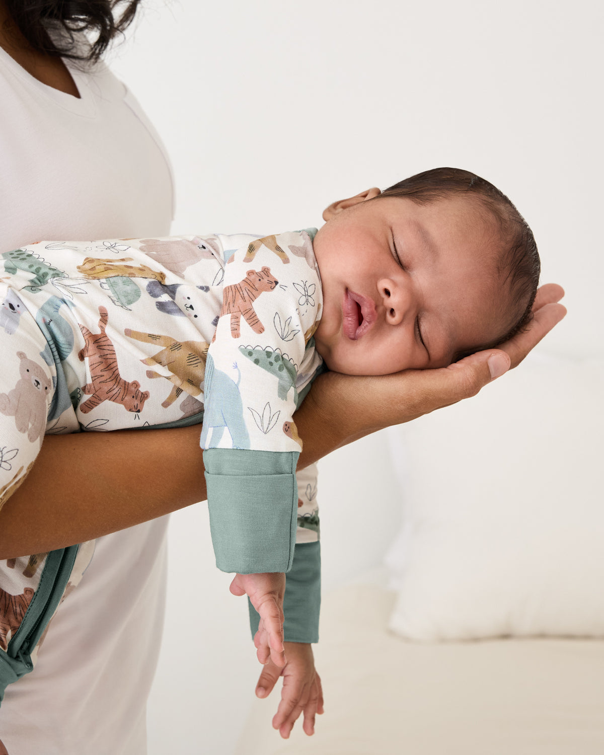 Adult holding sleeping baby wearing the Sweet Safari Zippy