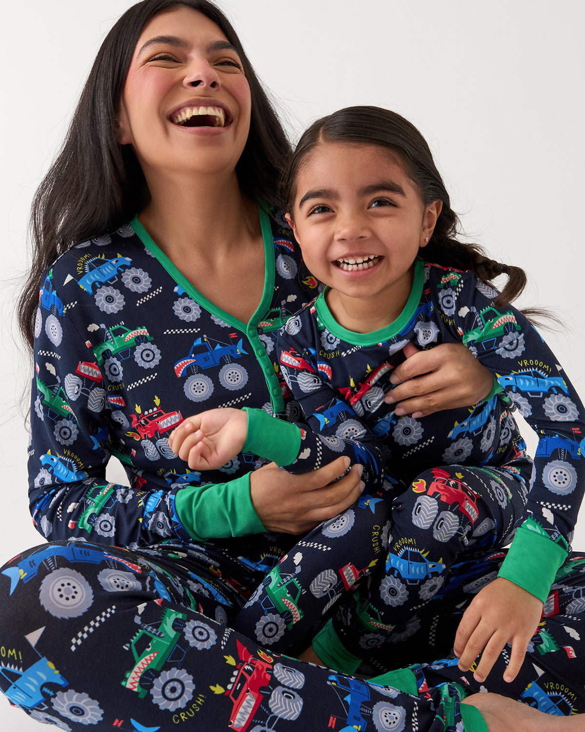 Mother and daughter wearing matching Monster Truck Madness pajamas