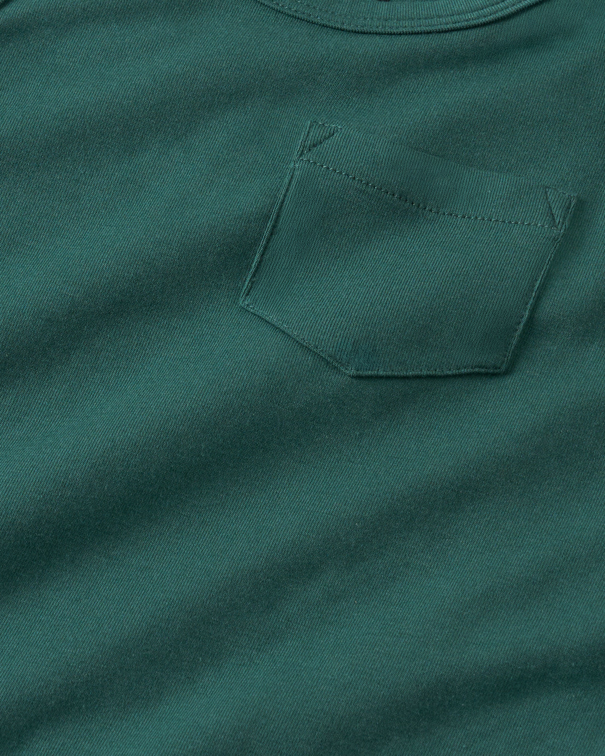 Close up of the pocket detail on the Muted Spruce Pocket Tank