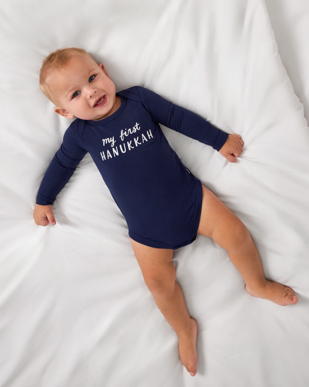 Aerial view of baby wearing the My First Hanukkah Bodysuit