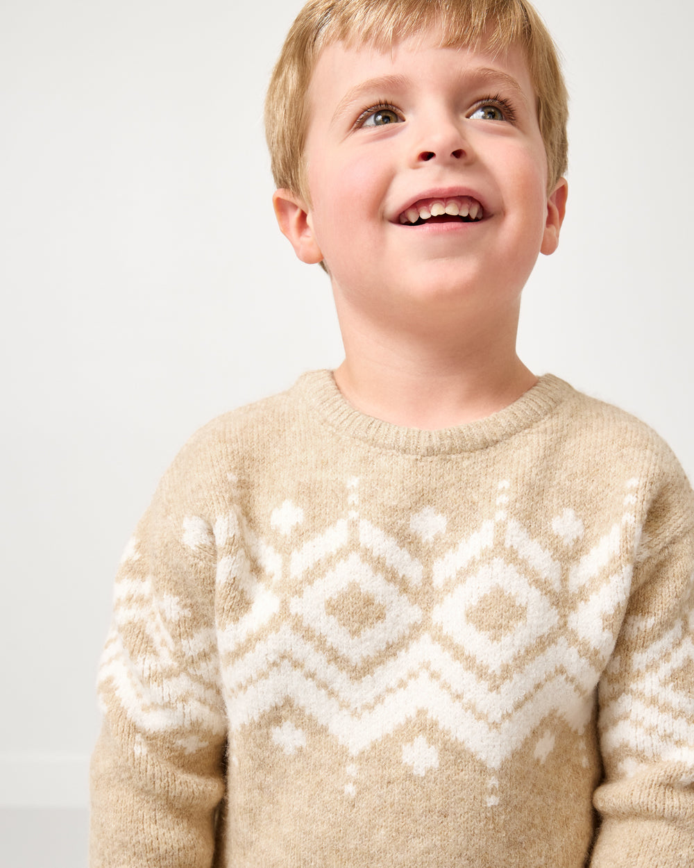 Close up of boy wearing the Neutral Fair Isle Sweater