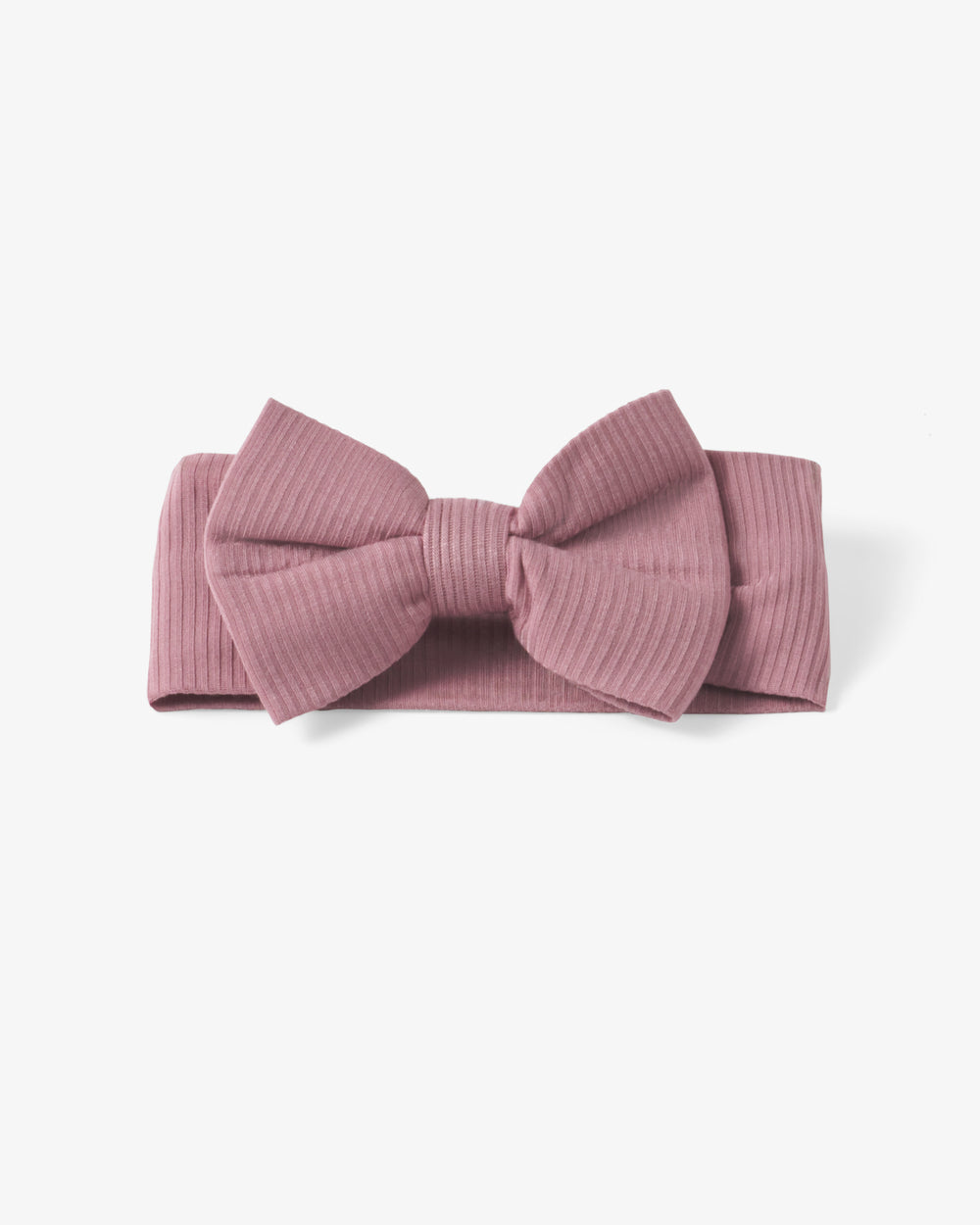 Flat lay of the Rosewood Ribbed Luxe Bow Headband