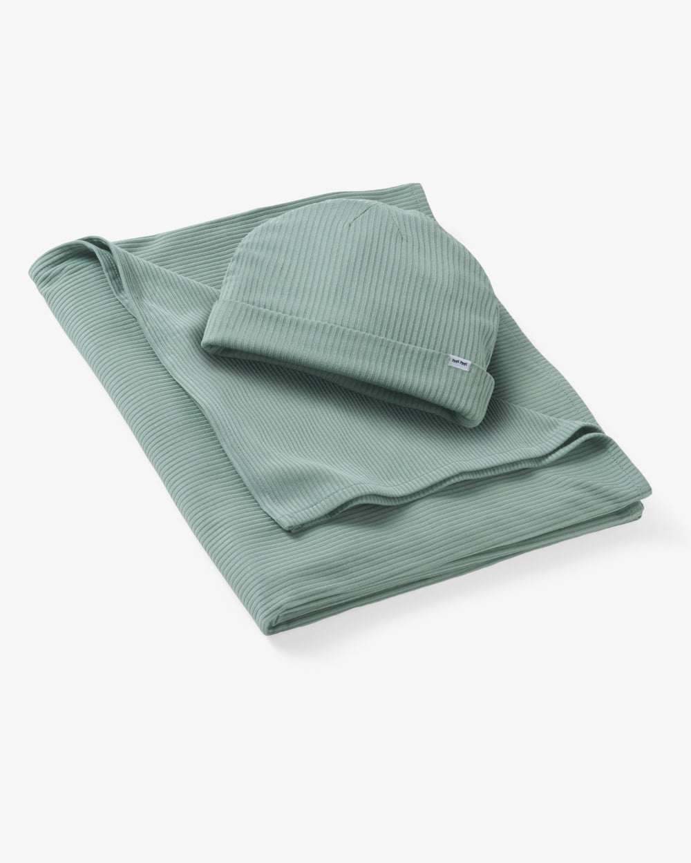 Flat lay of the Willow Baby Ribbed Swaddle & Infant Beanie Set