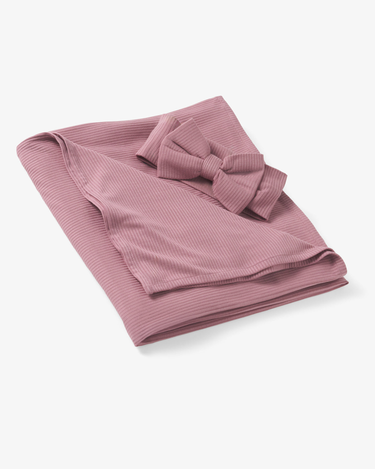 Flat lay of the Rosewood Ribbed Swaddle & Luxe Bow Headband Set