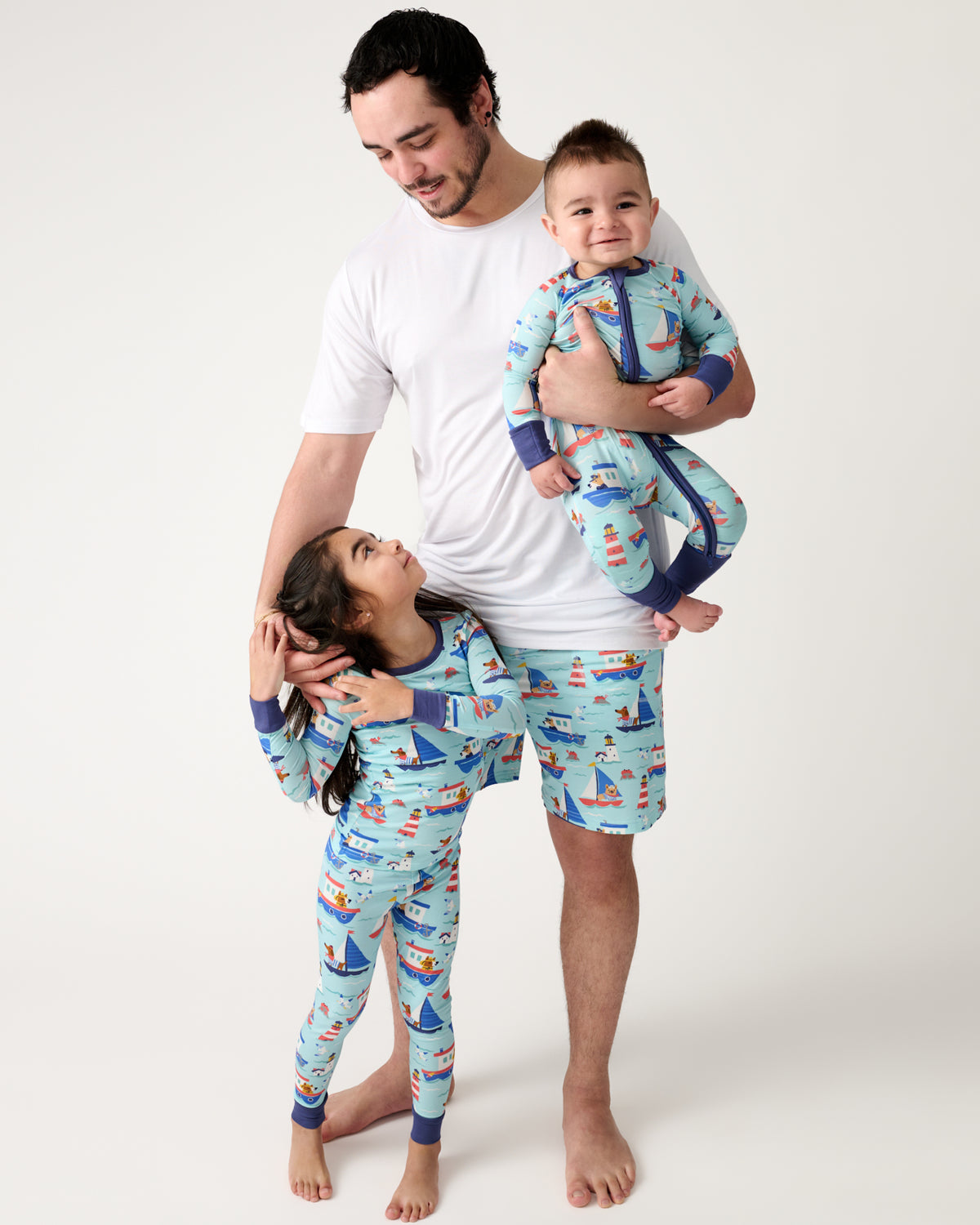Father and two children wearing Nautical Paws pajamas