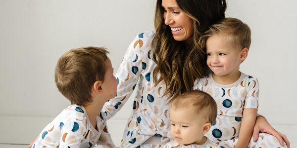 Family of four wearing Luna Neutral family matching pajamas
