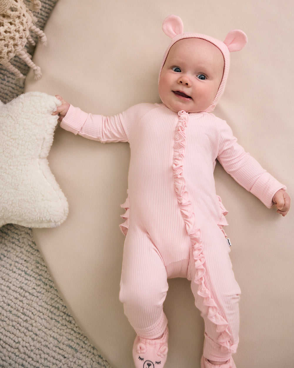 Newborn wearing the Prima Pink Bear Bonnet