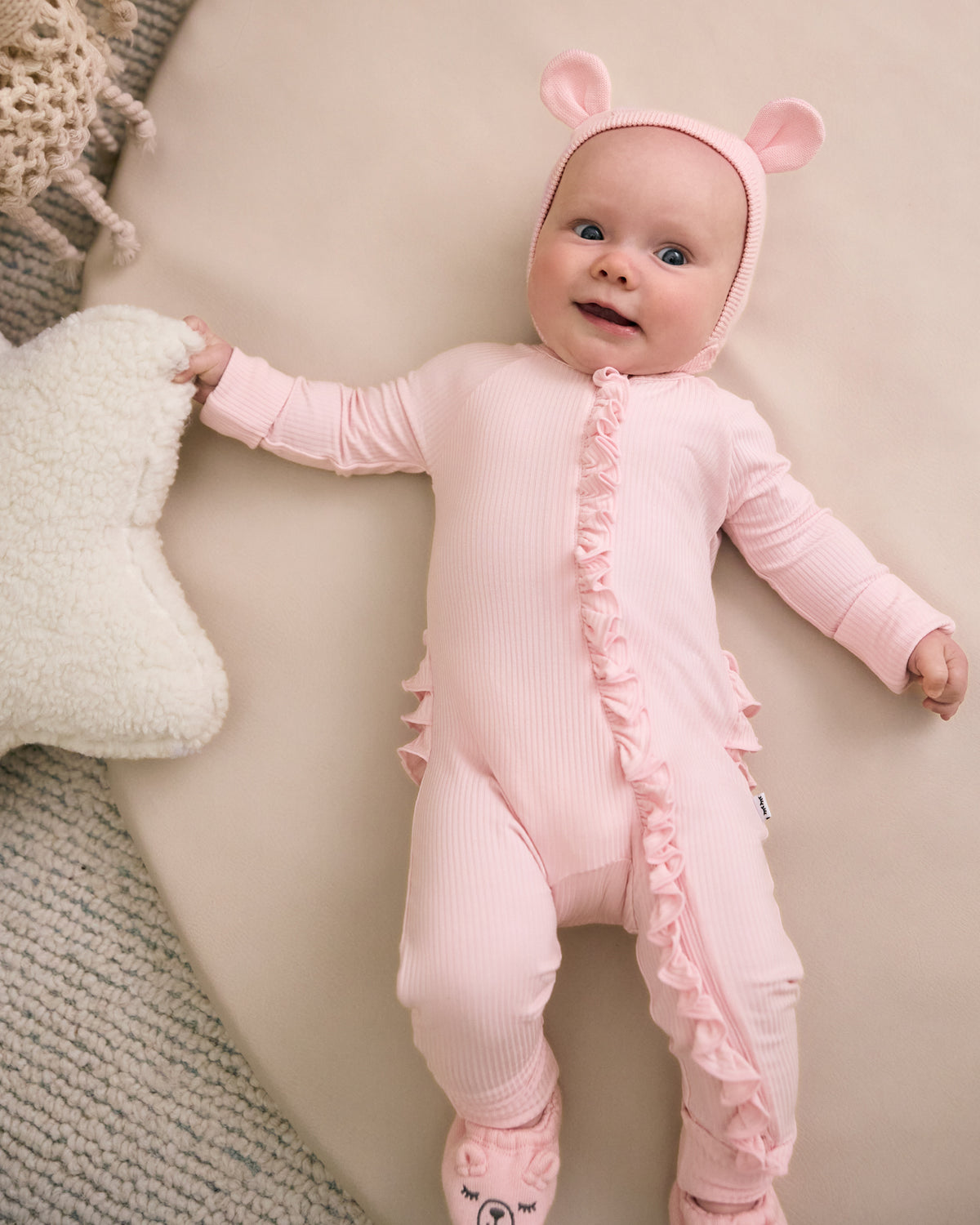 Newborn wearing the Prima Pink Bear Bonnet