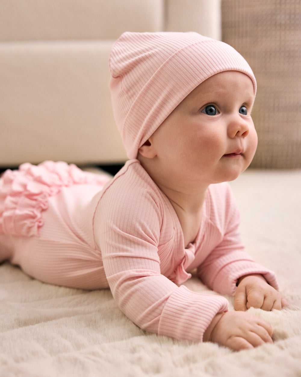 Baby wearing the Prima Pink Ribbed Infant Beanie