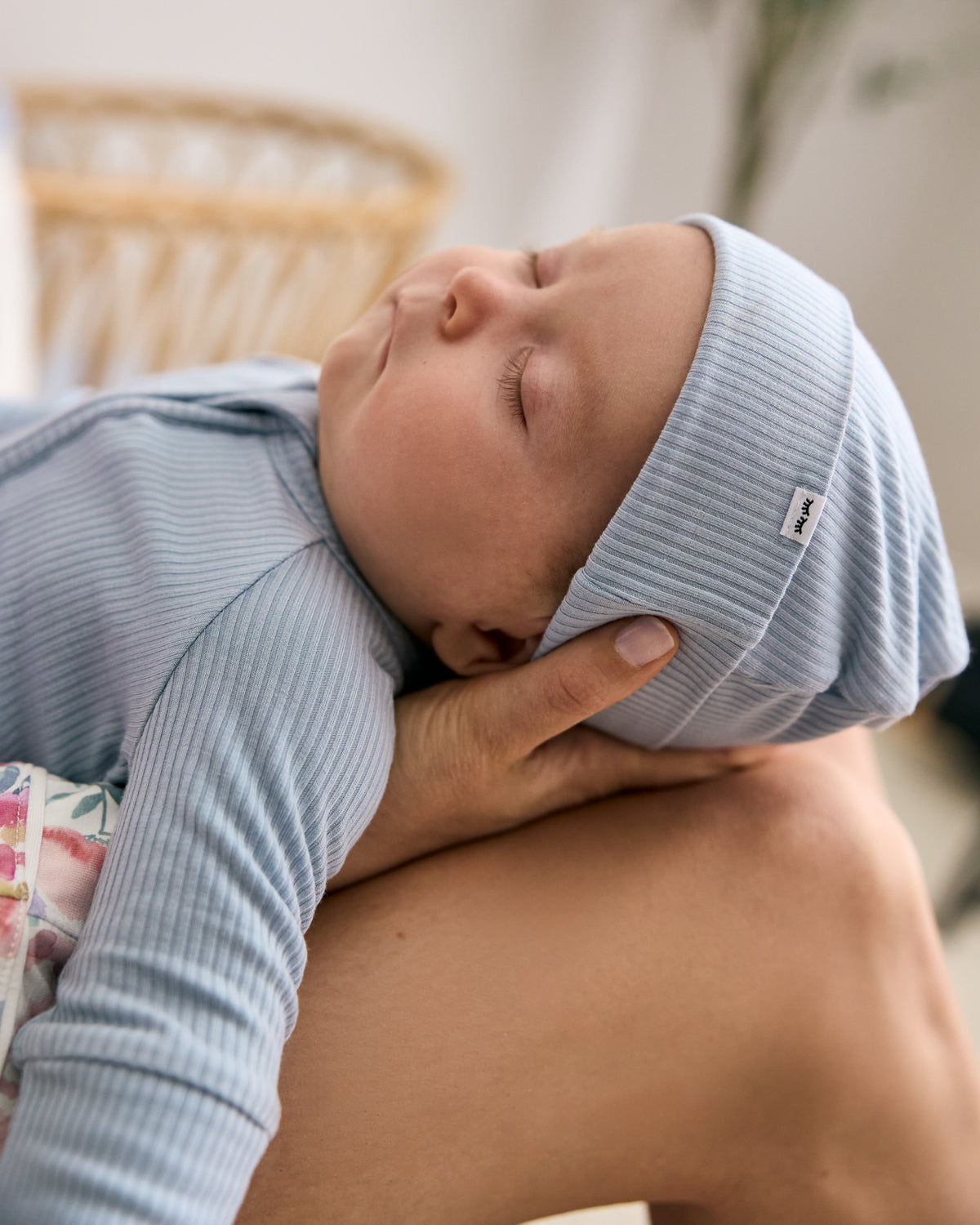 Newborn wearing the Light Fog Ribbed Infant Beanie