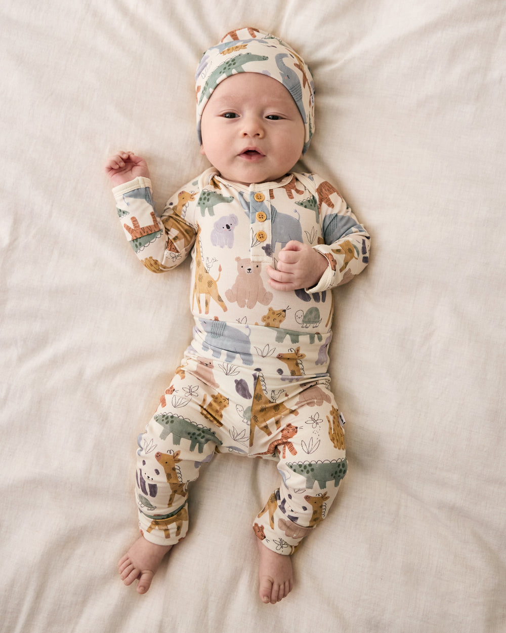 Aerial view of baby wearing the Sweet Safari Infant Beanie with a matching outfit