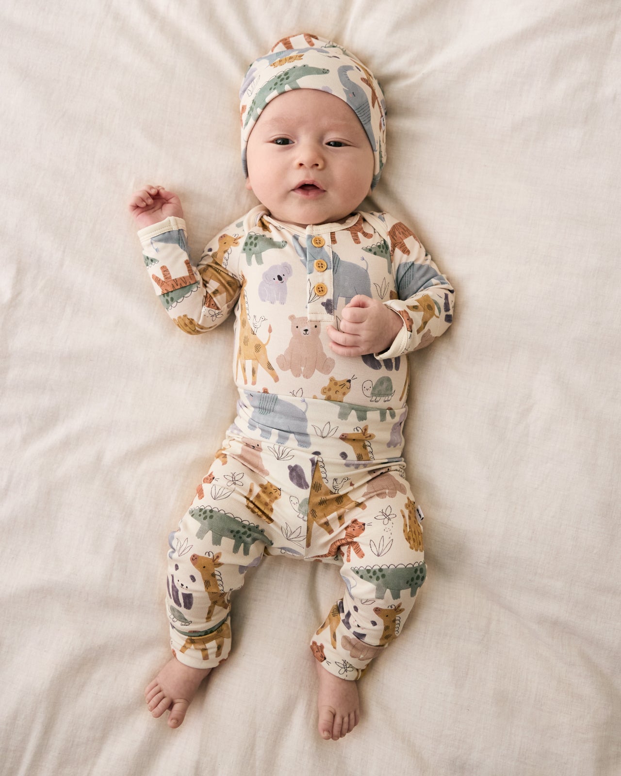 Aerial view of baby wearing the Sweet Safari Infant Beanie with a matching outfit