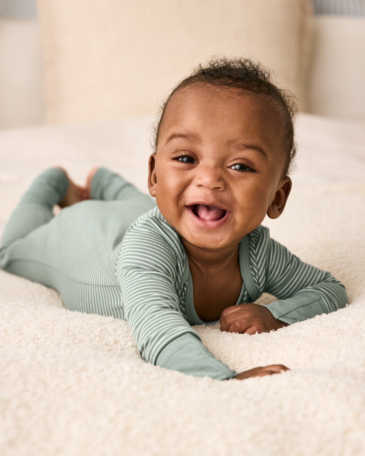 Newborn baby wearing the Willow Stripe Crescent Zippy