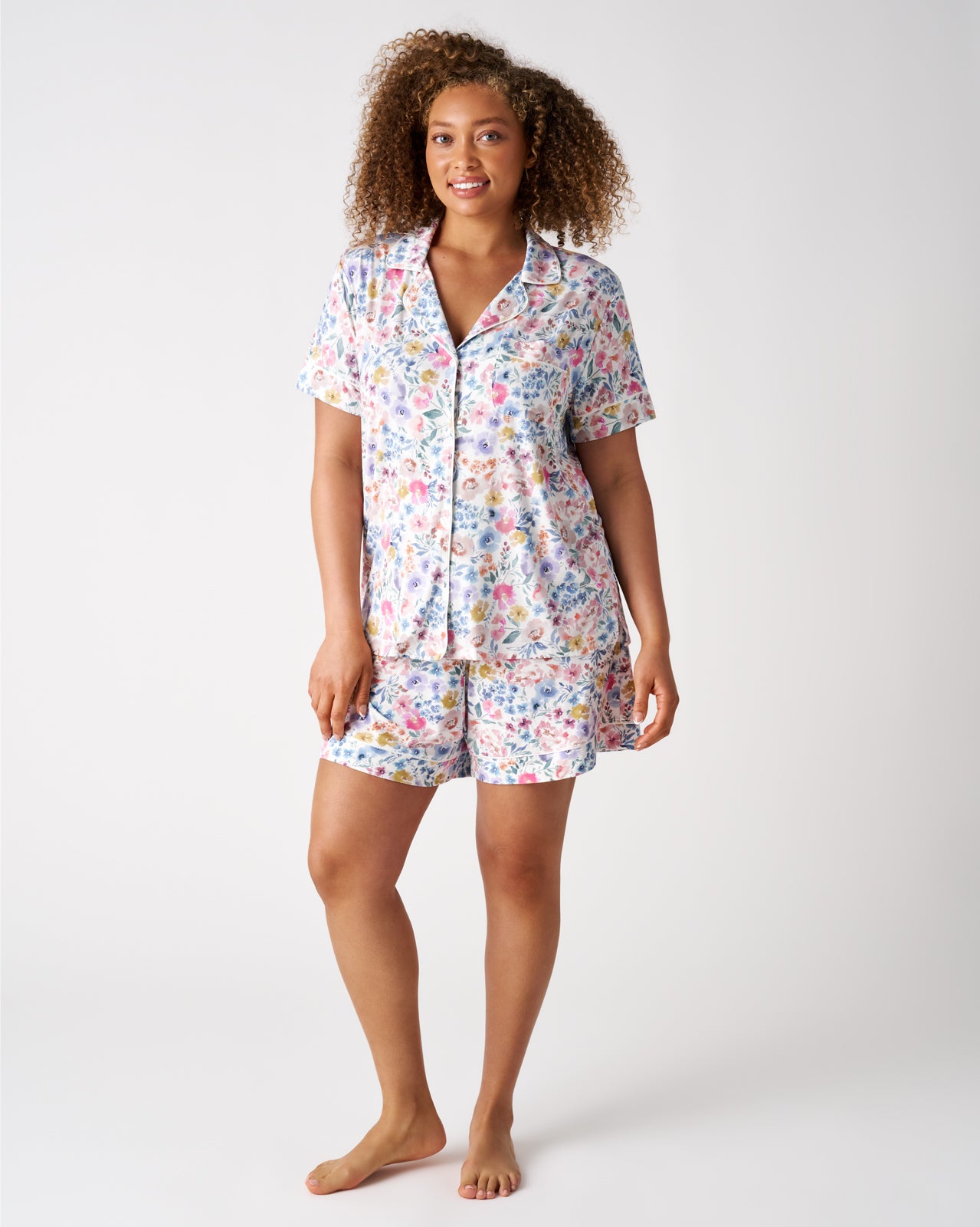 Woman wearing the Tiny Blooms Women's Short Sleeve & Shorts Pajama Set