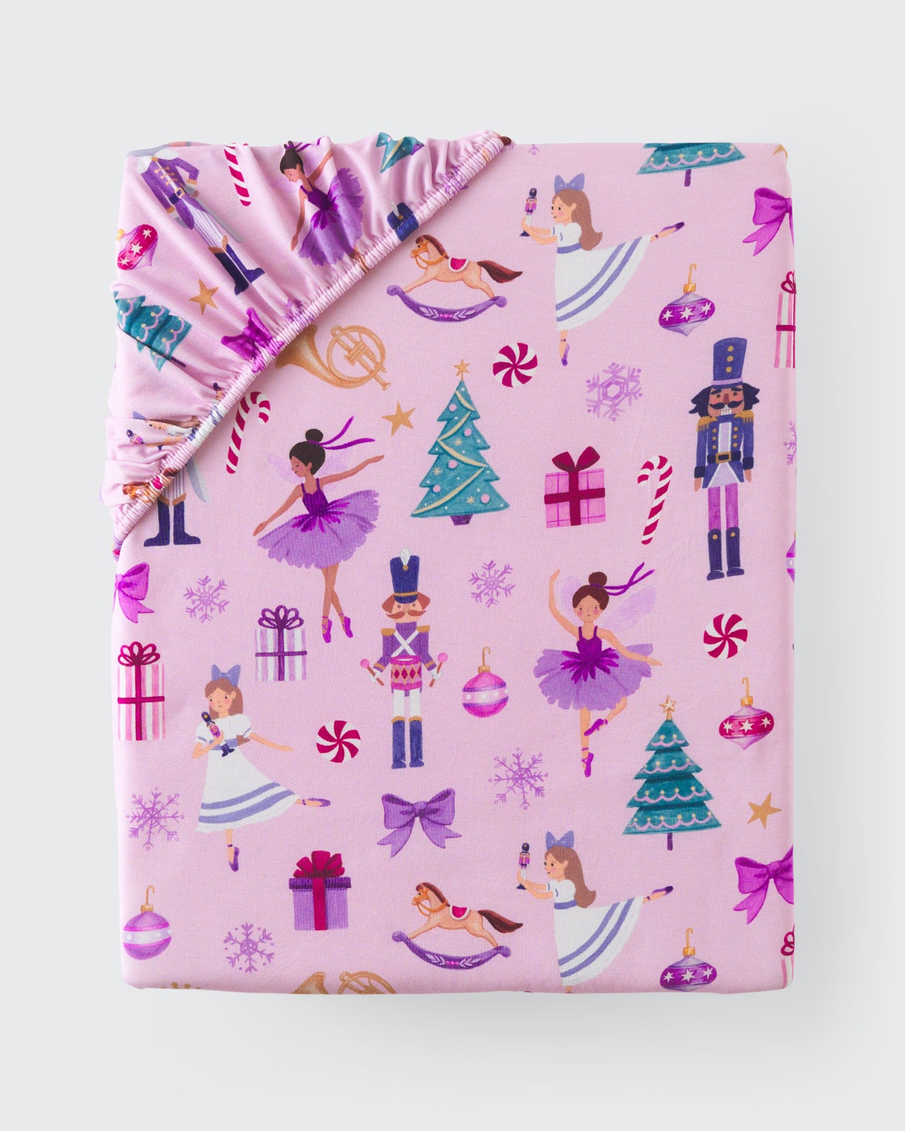 Flat lay of the Nutcracker March Fitted Crib Sheet