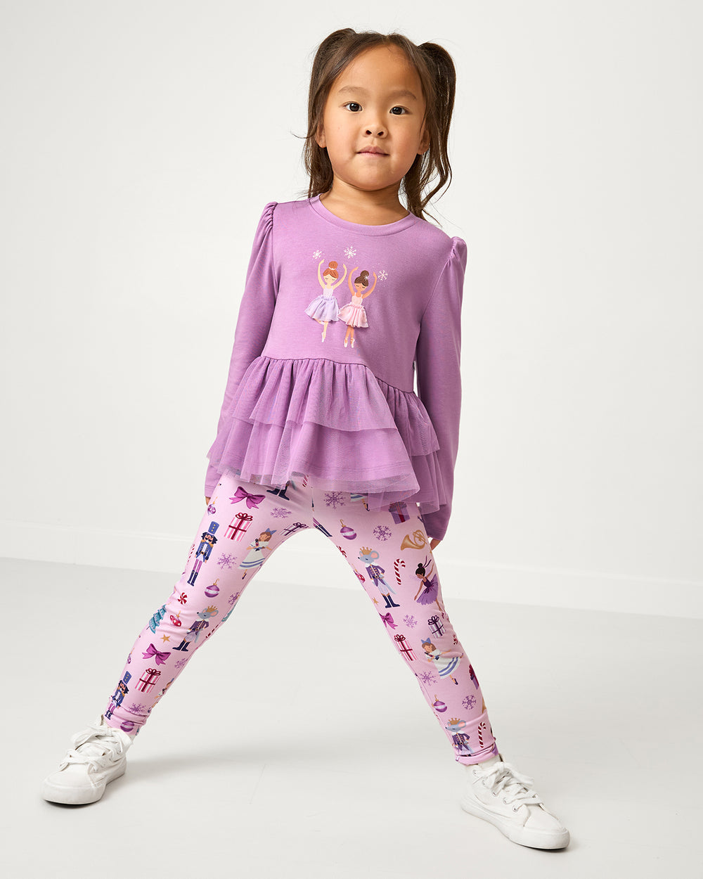 Girl wearing the Ballerina Tiered Peplum Top with Nutcracker Ballet leggings