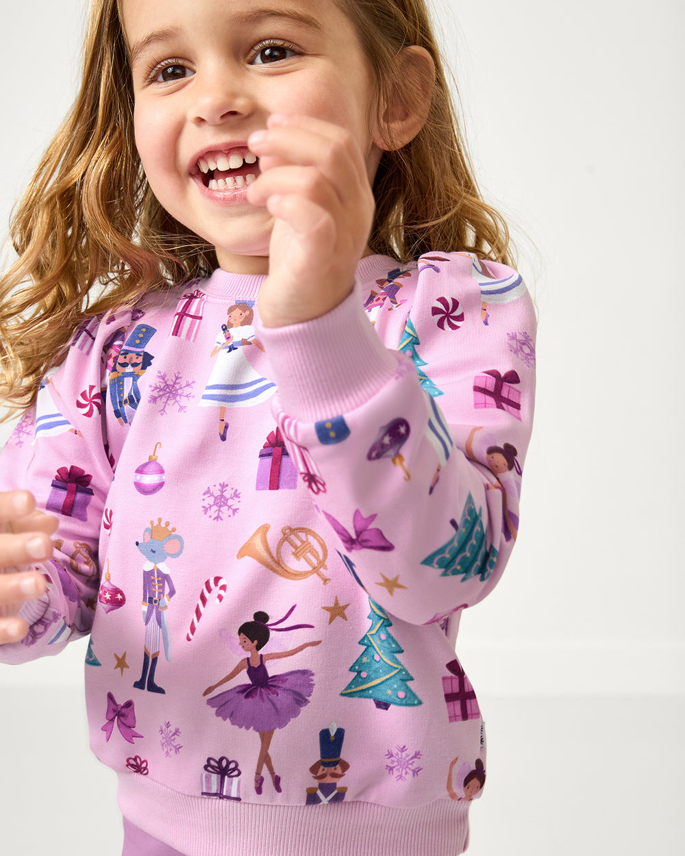 Close up of girl wearing the Nutcracker Ballet Puff Sleeve Crewneck