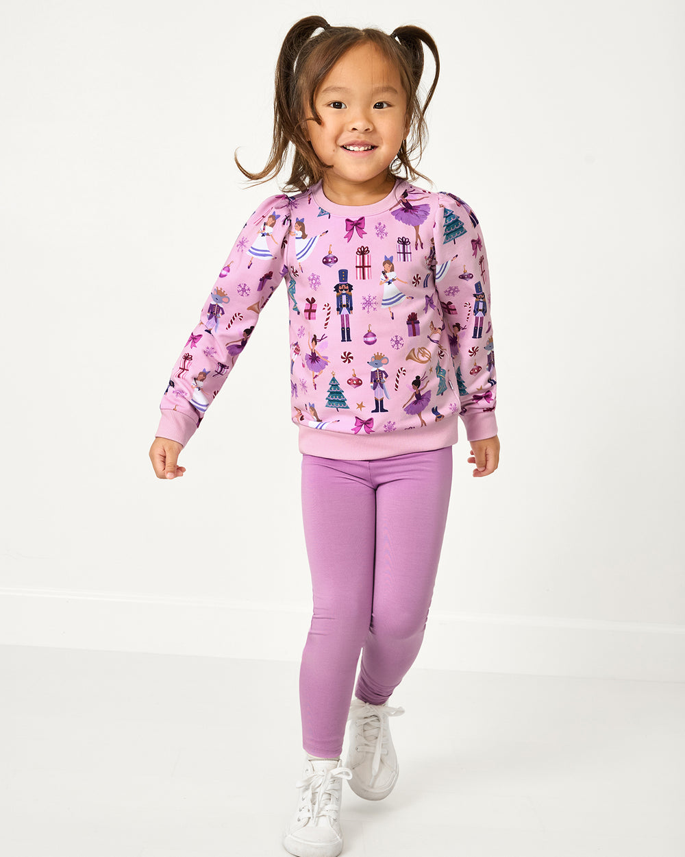 Girl wearing the Lavender Herb Legging with the Nutcracker themed sweatshirt