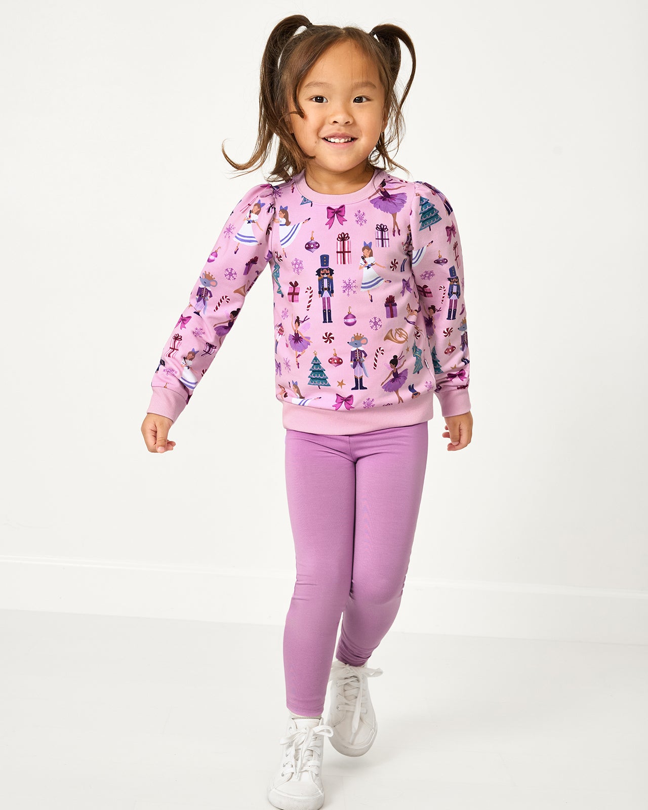 Girl wearing the Lavender Herb Legging with the Nutcracker themed sweatshirt