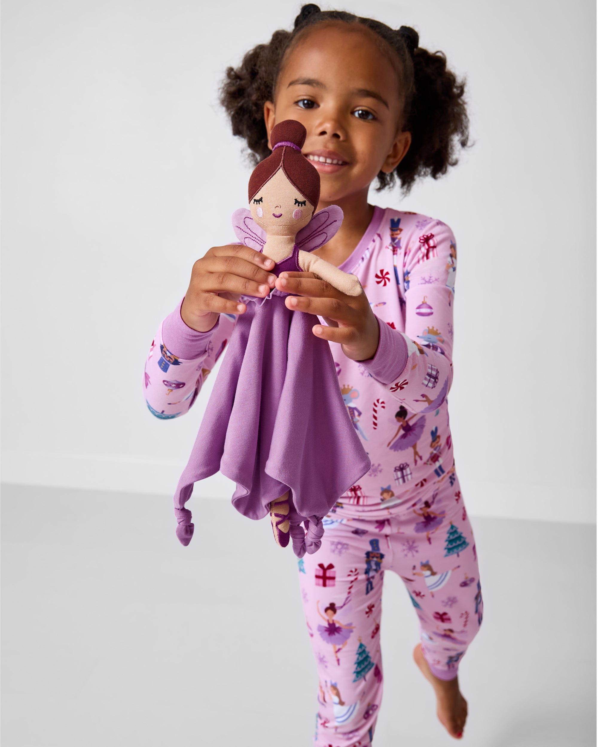 Alternate girl holding the Marie the Sugarplum Fairy Sleepyhead Lovey