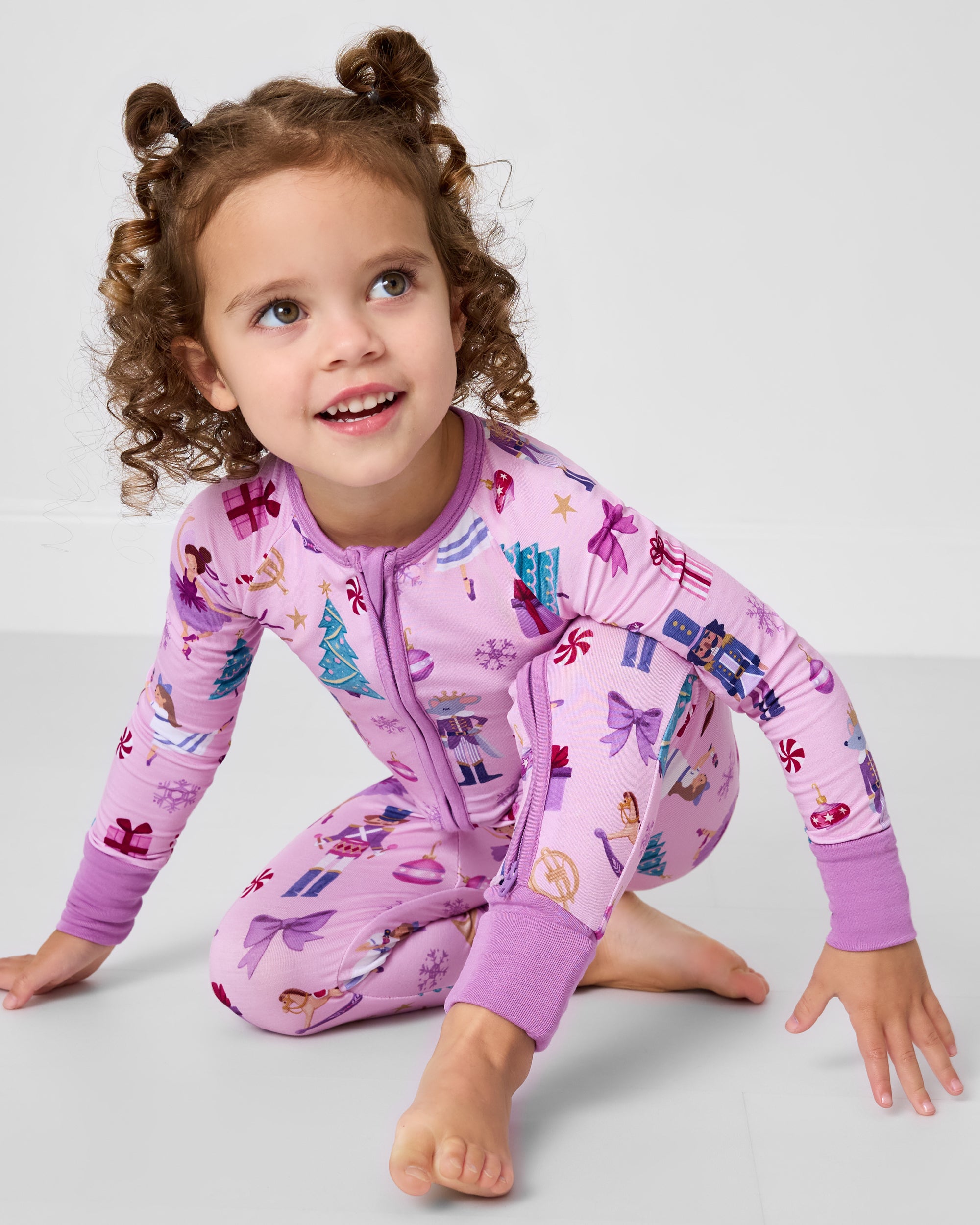 Crawling child wearing the Nutcracker Ballet Zippy