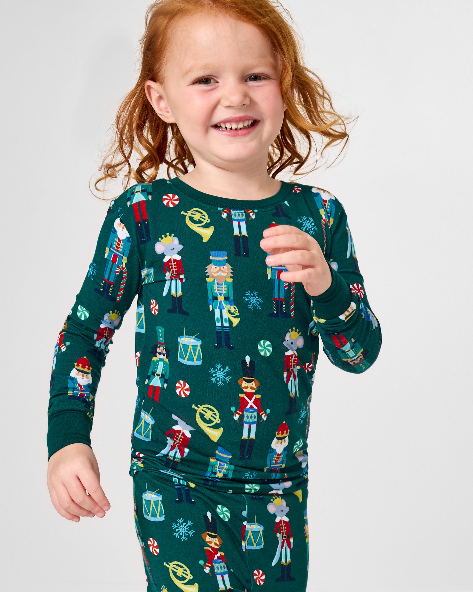 Close up of girl wearing the Nutcracker March Two-Piece Pajama Set
