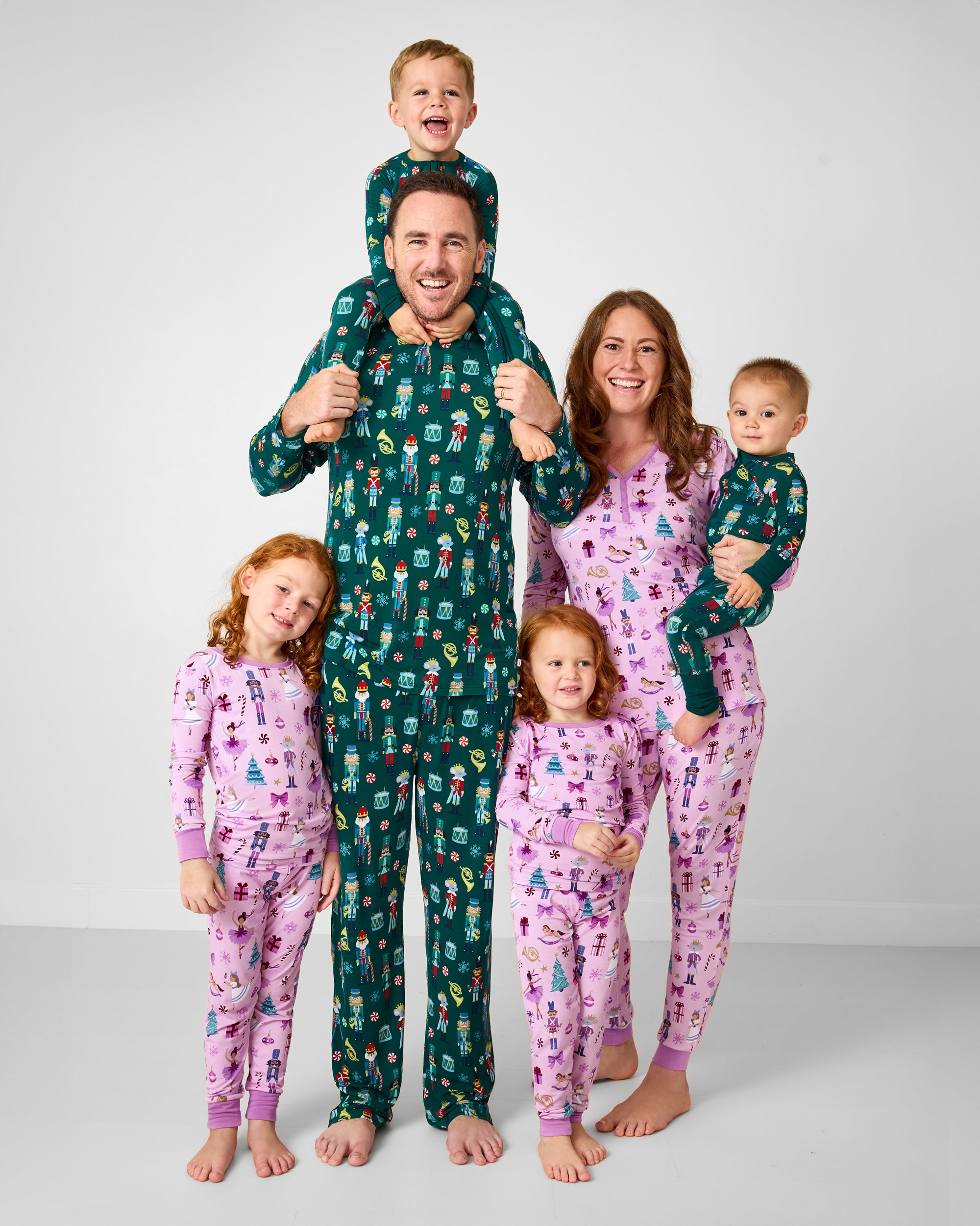 Family of six wearing matching Nutcracker March and Nutcracker Ballet Pajamas
