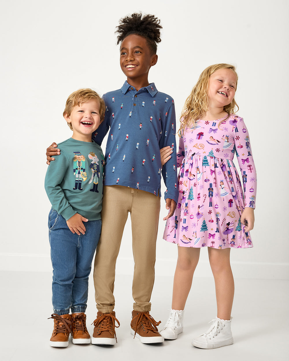 Three kids wearing styles from the Nutcracker play collection