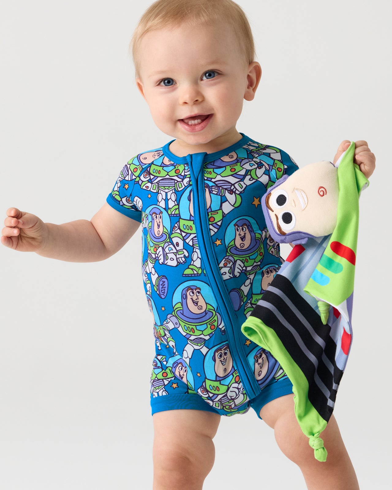 Baby holding the Pixar Toy Story Buzz Lightyear Lovey