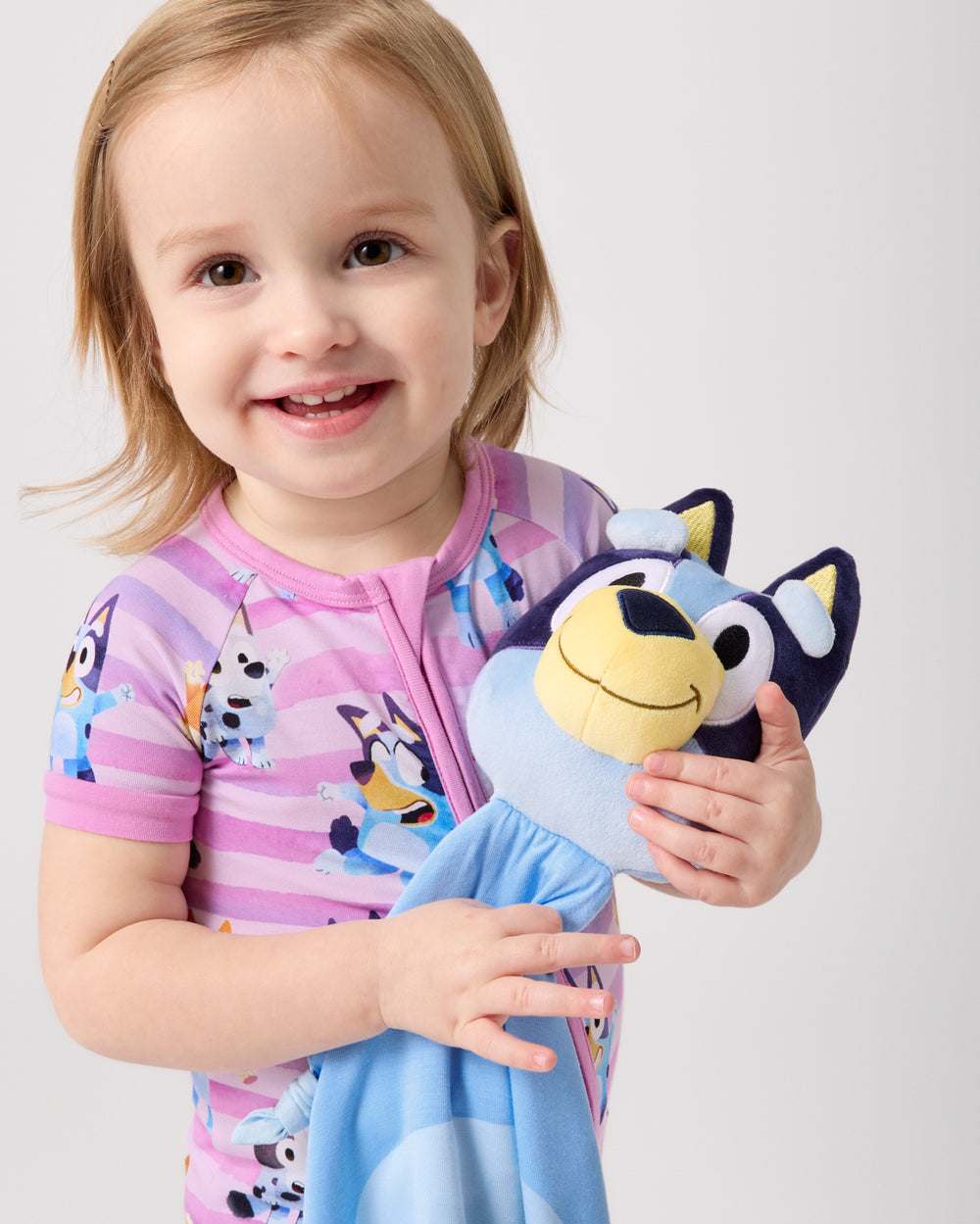 Girl holding the Bluey Lovey
