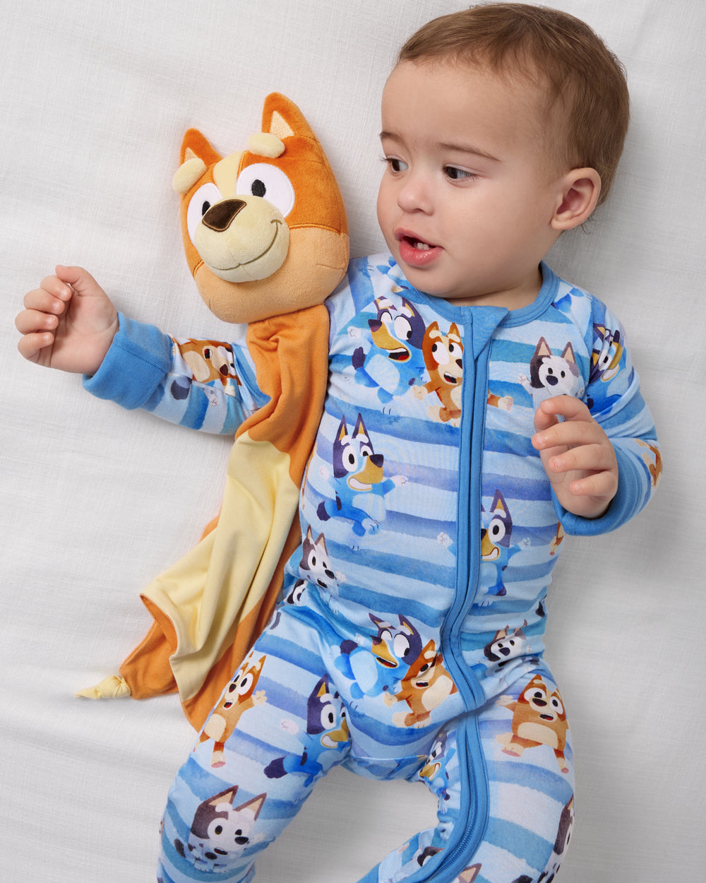 Baby laying with the Bingo Lovey