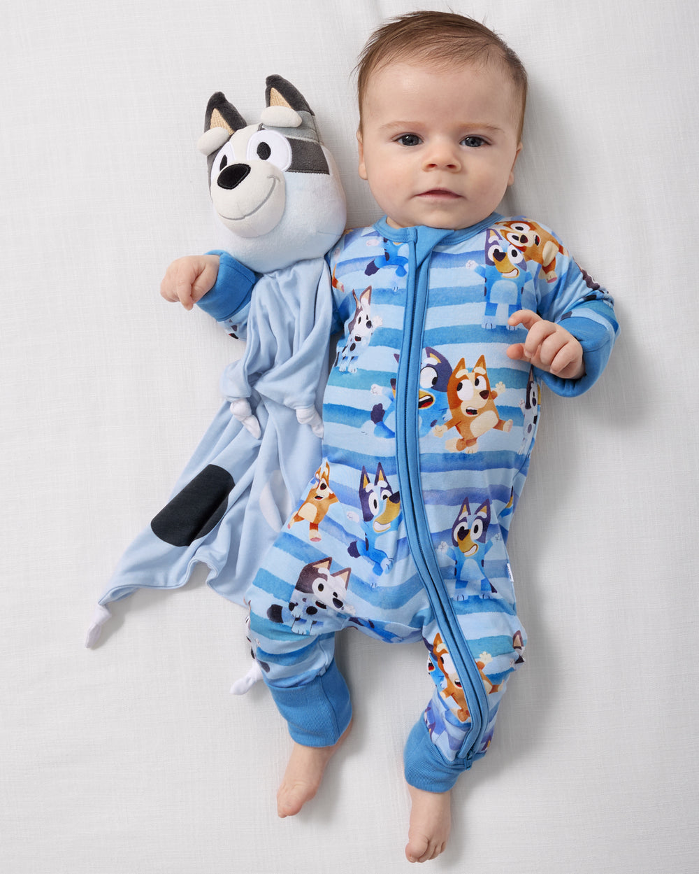 Baby laying next to the Muffin Lovey