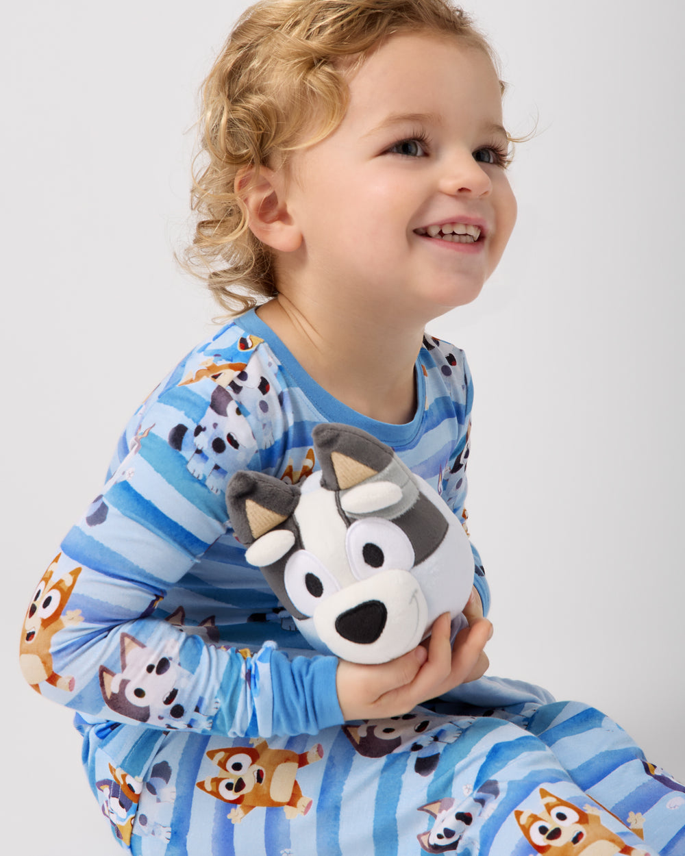 Child holding the Muffin Lovey