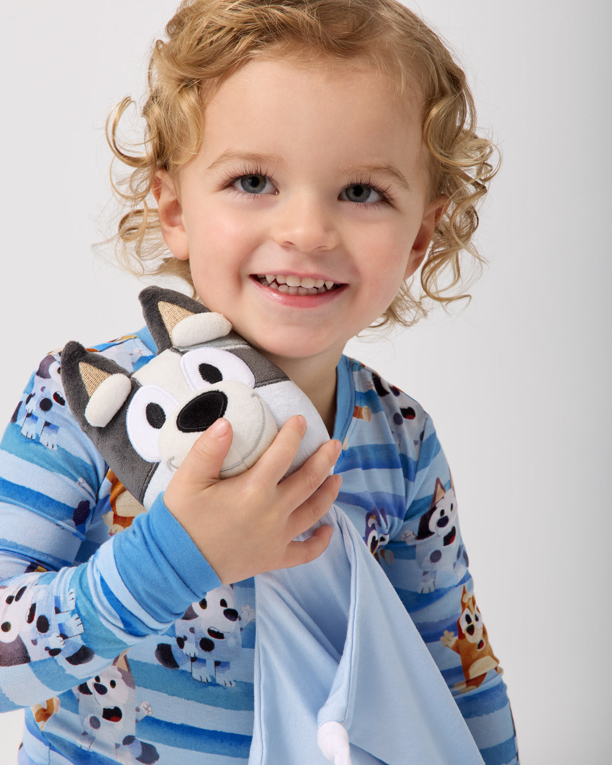 Close up of child holding the Muffin Lovey
