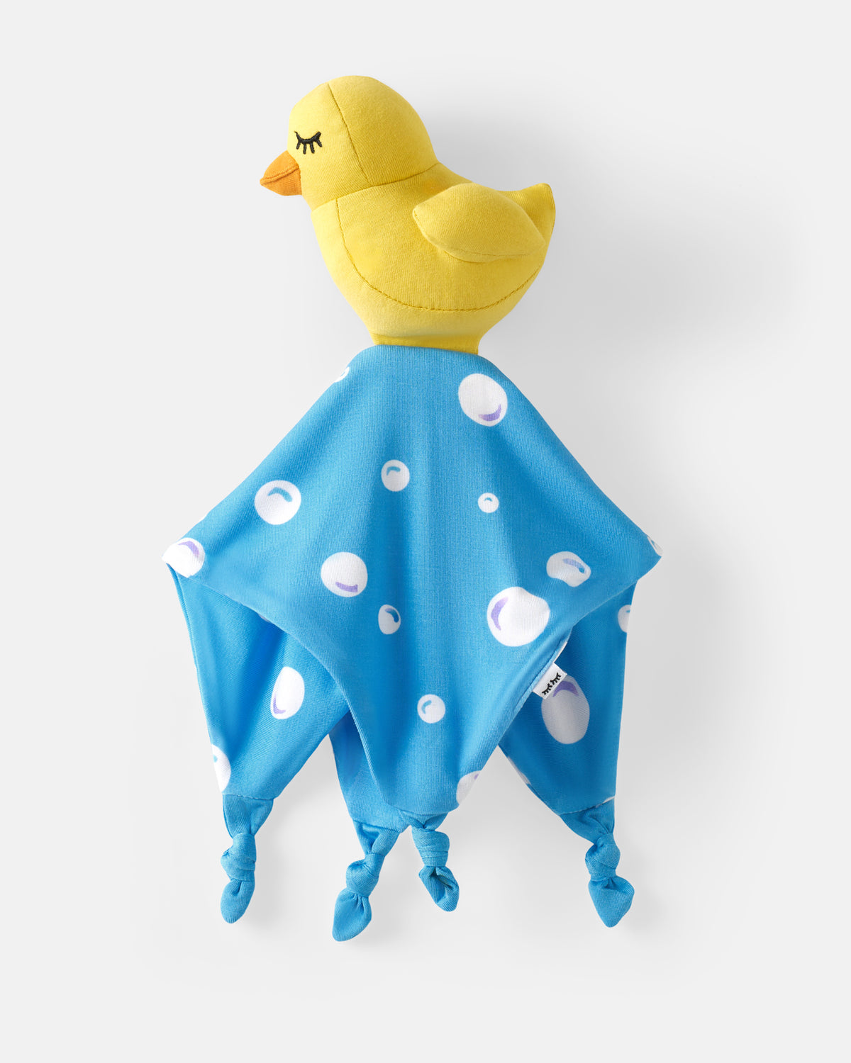 A yellow plush duck comforter with a blue knotted blanket featuring white polka dots, shown against a light gray background.