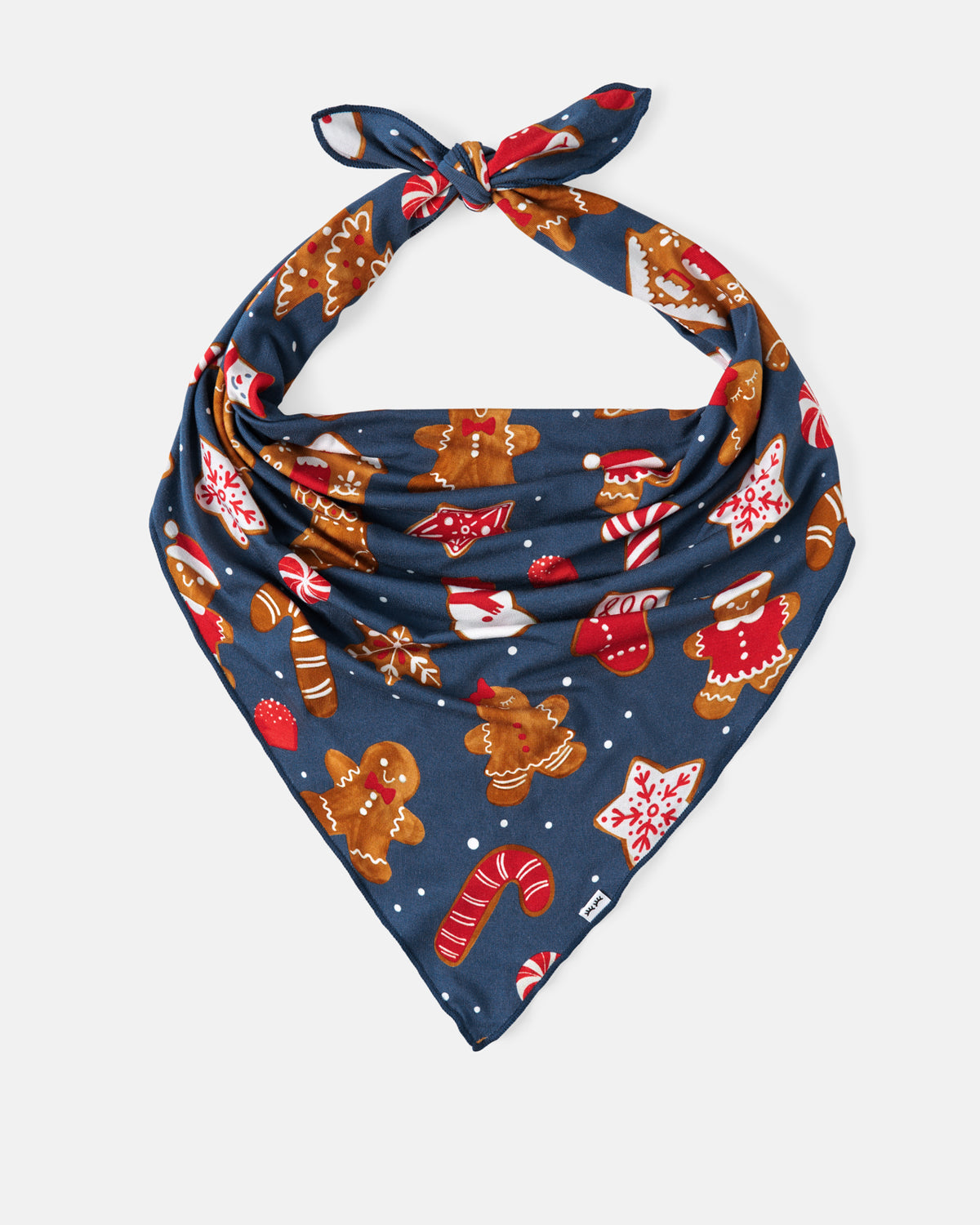 A navy blue knotted pet bandana featuring a festive Christmas print with gingerbread men, candy canes, Santa Claus, and snowflakes, displayed on a light gray background.