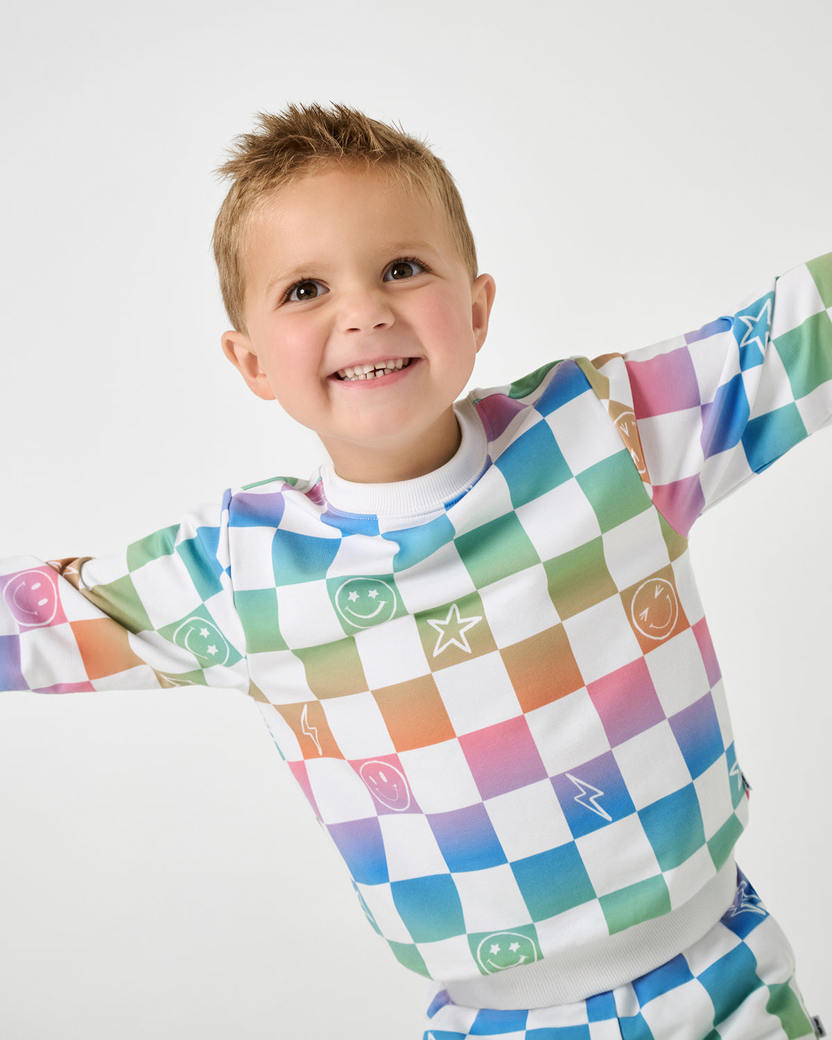Close up of boy wearing the Ombre Cheery Checks Crewneck Sweatshirt