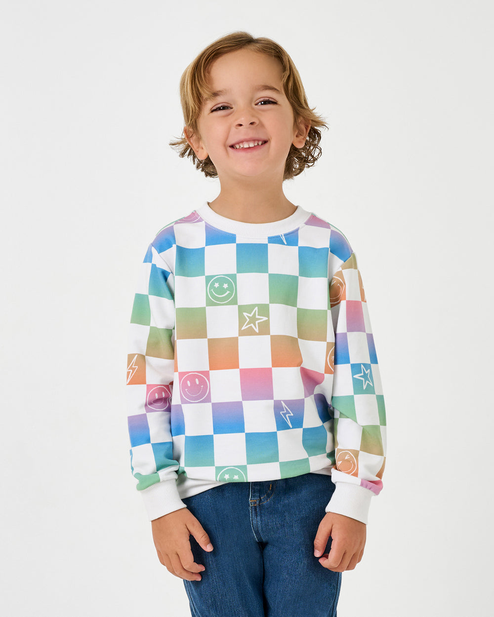 Boy wearing the Ombre Cheery Checks Crewneck Sweatshirt with denim joggers