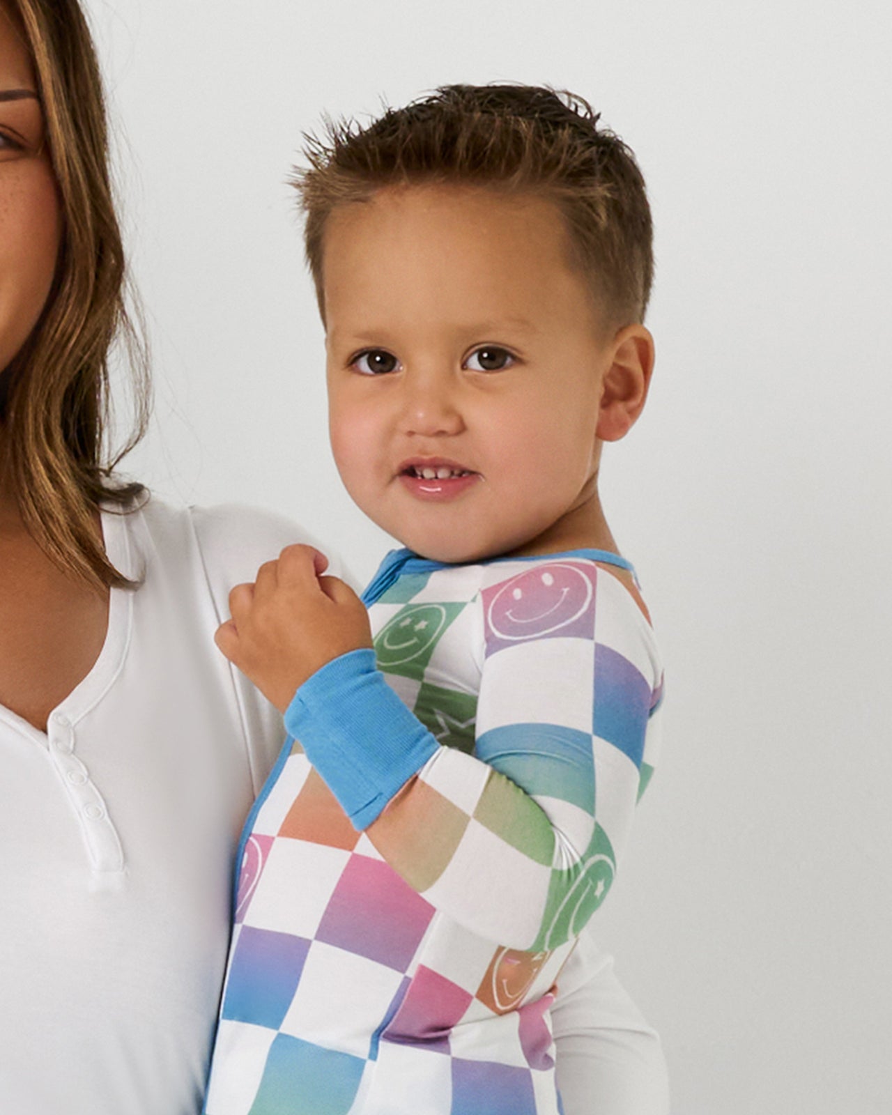 Close up of boy wearing the Ombre Cheery Checks Zippy