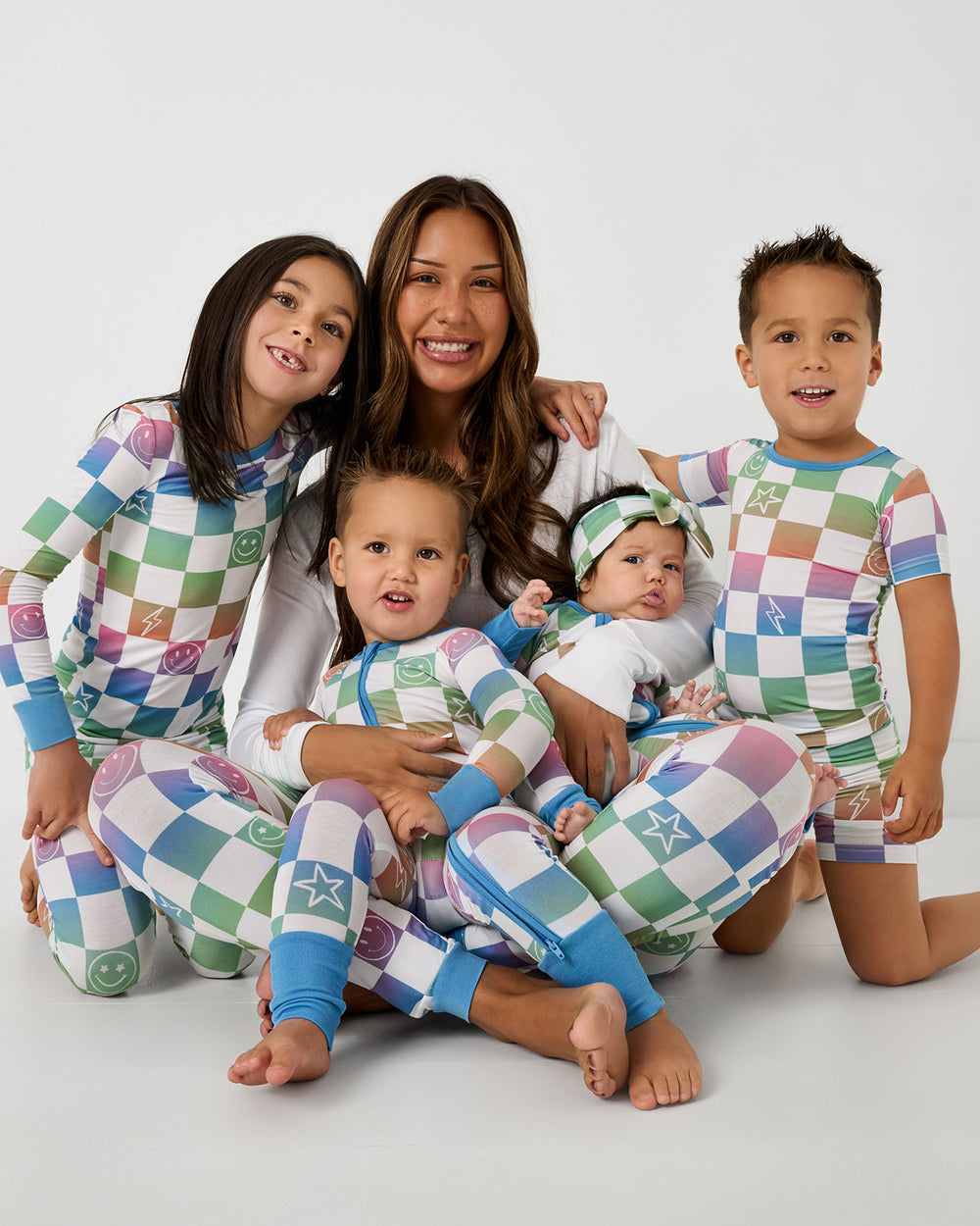 Mother and four children wearing matching Ombre Cheery Checks bamboo pajamas