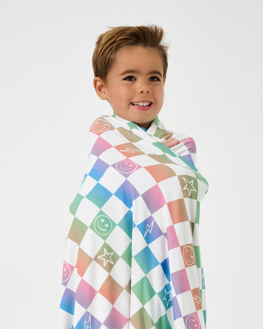 Boy wrapped in the Ombre Cheery Checks Large Cloud Blanket®