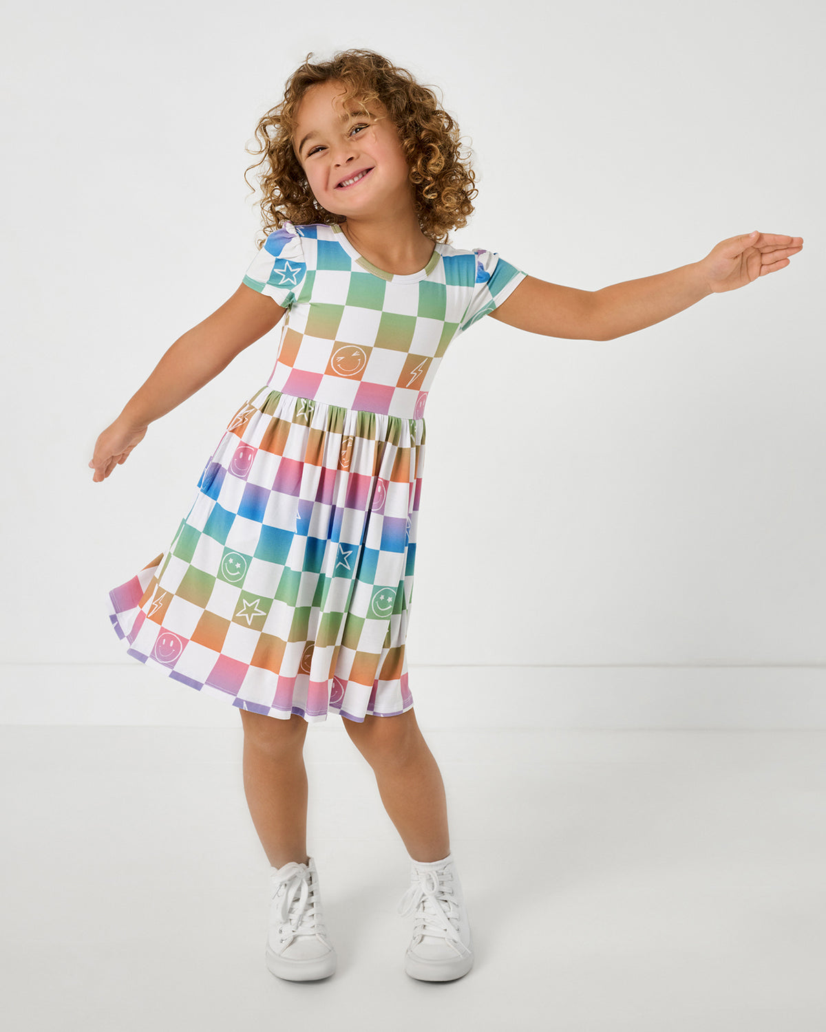 Posing girl wearing the Ombre Cheery Checks Skater Dress