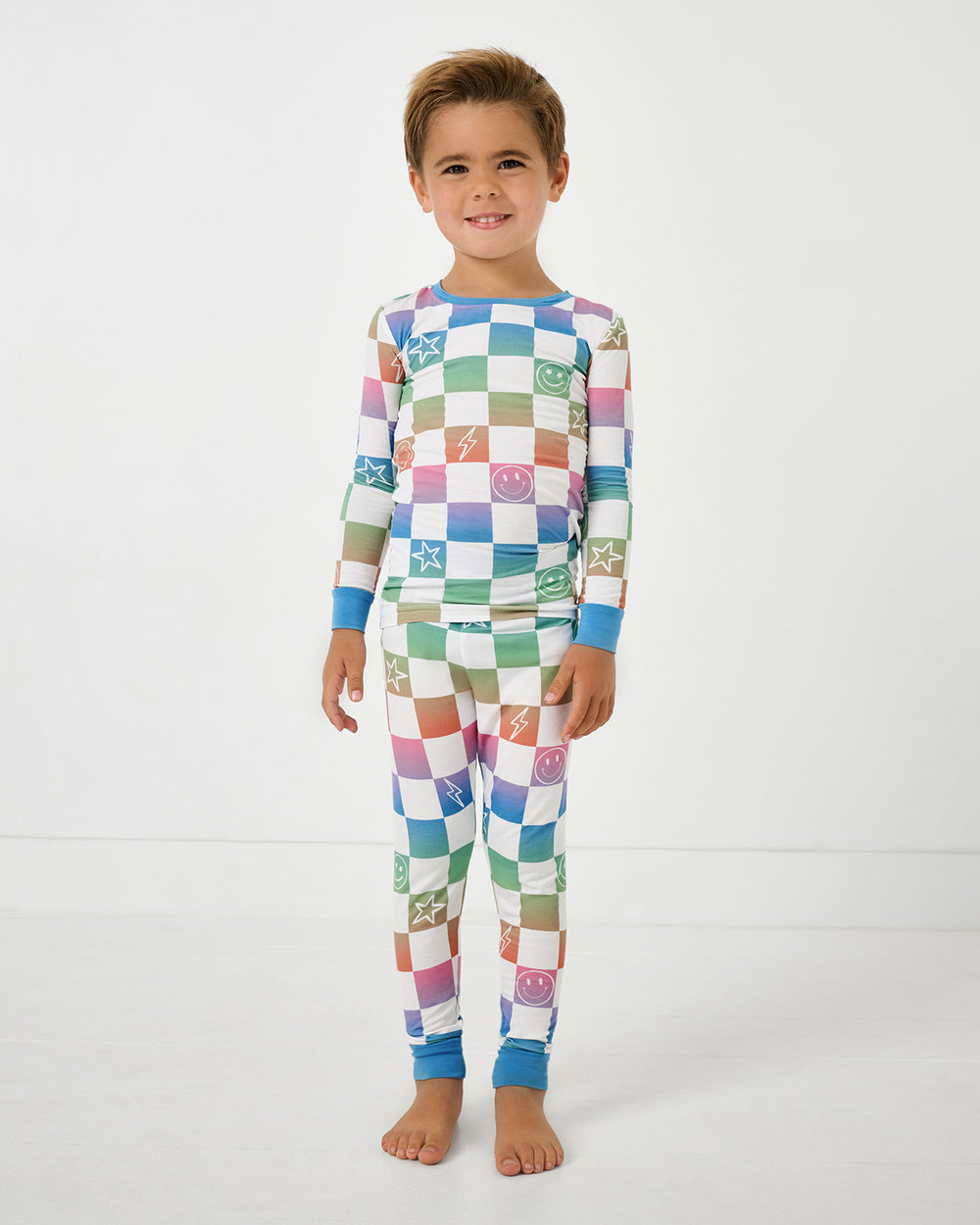 Standing boy wearing the Ombre Cheery Checks Two-Piece Pajama Set