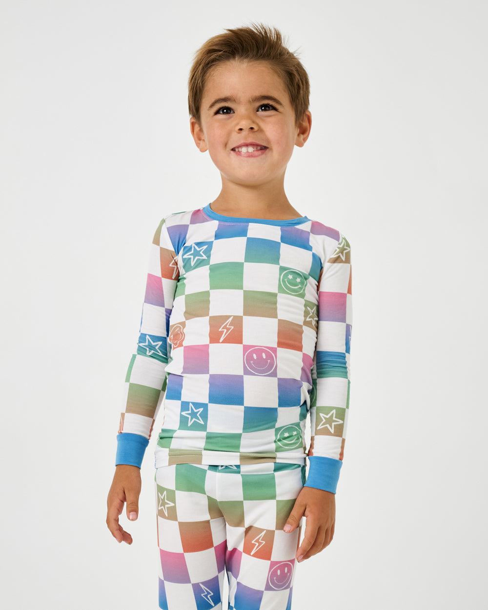 Close up of boy wearing the Ombre Cheery Checks Two-Piece Pajama Set