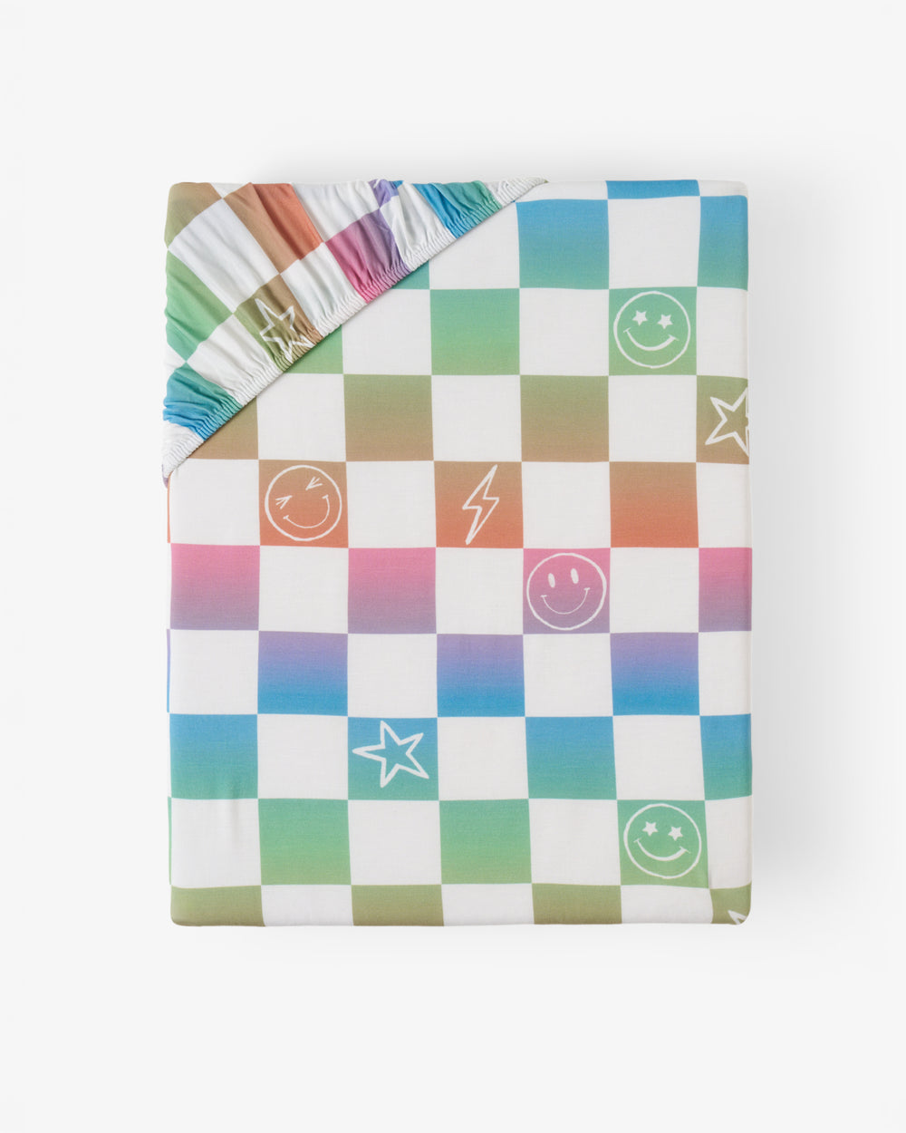 Flat lay of the Ombre Cheery Checks Fitted Crib Sheet