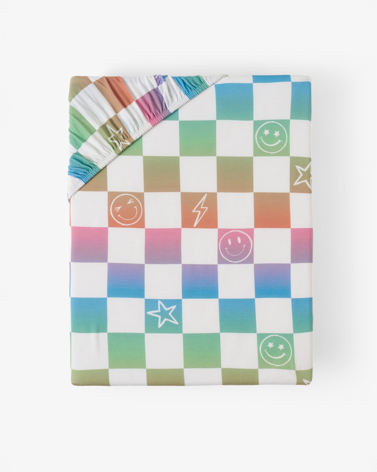 Flat lay of the Ombre Cheery Checks Fitted Crib Sheet