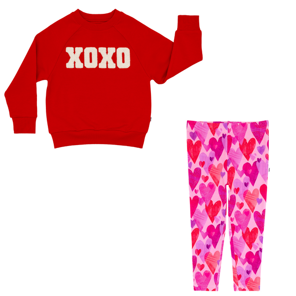 flat lay composite of an xoxo crewneck sweatshirt and pink hearts & crafts legging