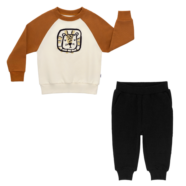 flat lay composite of an arctic raglan crewneck and black jogger